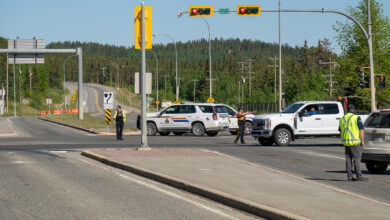 TRIBUTES POUR IN FOR VICTIM – The RCMP closed a stretch of the Alaska Highway from Two Mile Hill (above) to Porter Creek last Thursday while investigating the fatal collision. (Vince Fedoroff / The Yukon Star)